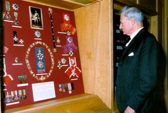 Earl Kitchener of Khartoum examines his great uncle's medals